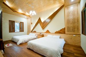 Postel nebo postele na pokoji v ubytování ChunYang Homestay春陽一品居