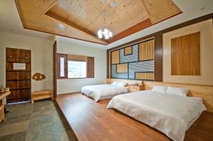A bed or beds in a room at ChunYang Homestay春陽一品居
