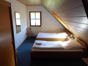 Säng eller sängar i ett rum på Landgasthof Zum Hirschen