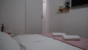 Posteľ alebo postele v izbe v ubytovaní Apartments Nera