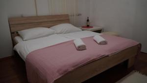 Posteľ alebo postele v izbe v ubytovaní Apartments Nera