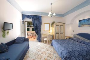 Postel nebo postele na pokoji v ubytování Hotel La Conchiglia