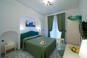 Postel nebo postele na pokoji v ubytování Hotel La Conchiglia