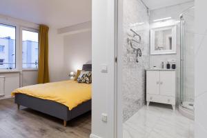 Ένα ή περισσότερα κρεβάτια σε δωμάτιο στο Pušyno apartamentai