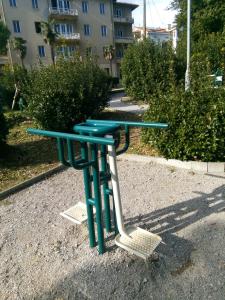 a blue picnic table with two chairs in a street at Apartment Tomic A-5 in Lovran