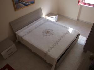 Letto o letti in una camera di Appartamento Francesco Torre Pali