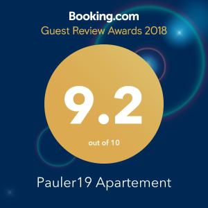 a flyer for a guest review awards with a yellow circle at Pauler19 Apartement in Budapest