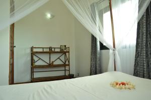 เตียงในห้องที่ Villa Malandy Appart Hôtel Duplex 1