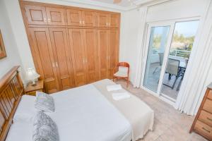 Posteľ alebo postele v izbe v ubytovaní Villa Lago Sol