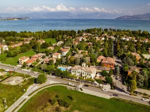 an aerial view of a town with houses and the water at Hotel Dogana in Sirmione