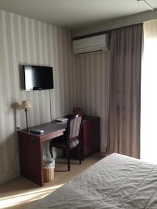 Postel nebo postele na pokoji v ubytování Hotel Prélude
