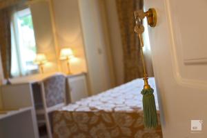Ένα ή περισσότερα κρεβάτια σε δωμάτιο στο Locanda Dei Cinque Cerri