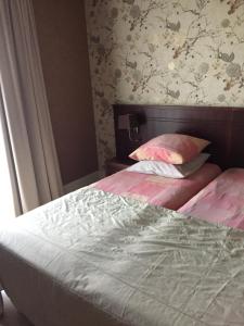 Postel nebo postele na pokoji v ubytování Hotel Prélude