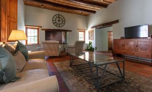 a living room with a couch and a coffee table at Andreas Country House in Wellington