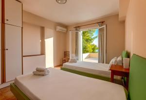 Ένα ή περισσότερα κρεβάτια σε δωμάτιο στο Zakynthos Seascape