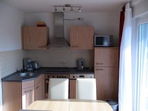 a kitchen with a sink and a counter top at Zum Strandkorb in Zingst
