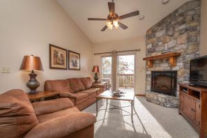 a living room with a couch and a fireplace at The Lodges at Table Rock by Capital Vacations in Branson