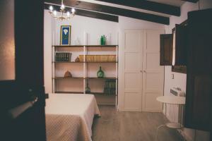 a room with a bed and a book shelf at La Guaxa, casina a 900 m de la playa de Poo VV-1371-AS in Llanes