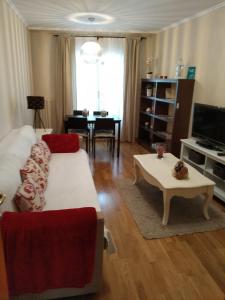 a living room with a couch and a table at El Collado 17 in Soria