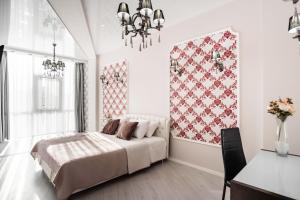 Posteľ alebo postele v izbe v ubytovaní Barkar ArCadia Apartments