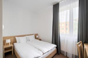 Posteľ alebo postele v izbe v ubytovaní Patra