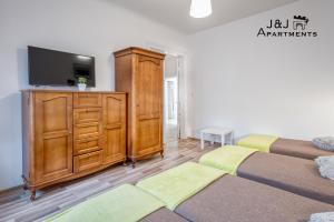 J&J Apartments Łazienna 30 - 10客房内的一张或多张床位