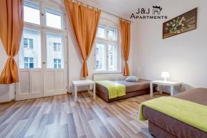 J&J Apartments Łazienna 30 - 10客房内的一张或多张床位