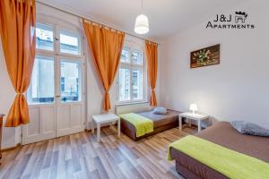 J&J Apartments Łazienna 30 - 10客房内的一张或多张床位