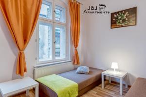 J&J Apartments Łazienna 30 - 10客房内的一张或多张床位