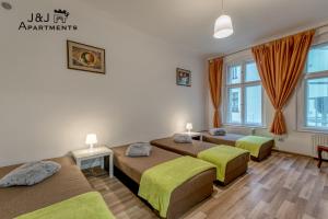 J&J Apartments Łazienna 30 - 10客房内的一张或多张床位