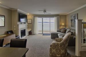 a living room with a couch and a fireplace at 312 Water Street Inn in Boyne City