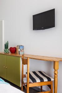 TV a/nebo společenská místnost v ubytování Hotel Madison