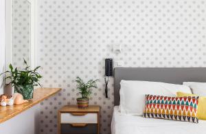 Postel nebo postele na pokoji v ubytování Hotel Madison