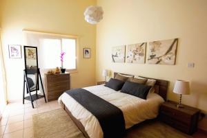 Postel nebo postele na pokoji v ubytování Alkinoou Residence