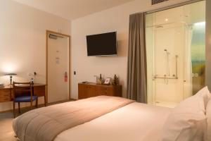 Cama ou camas em um quarto em Ohtel Wellington