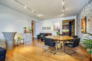 a living room with a table and chairs at Loft in Lower Nob Hill in San Francisco