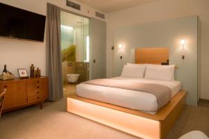 Cama ou camas em um quarto em Ohtel Wellington