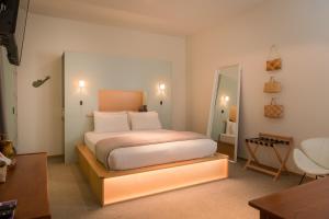 Cama ou camas em um quarto em Ohtel Wellington