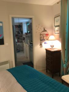 Кровать или кровати в номере "L'olivadou" ST JEAN CAP FERRAT
