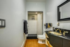a bathroom with a sink and a toilet at Loft in Lower Nob Hill in San Francisco