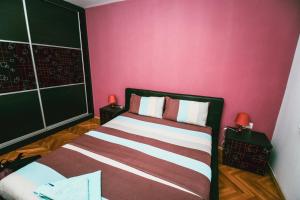 Postel nebo postele na pokoji v ubytování Square Vanilla Apartments