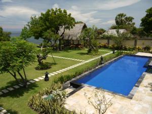 an aerial view of the garden and swimming pool of a house at Villa Wilali in Pemuteran