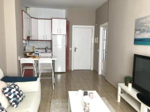 Telewizja i/lub zestaw kina domowego w obiekcie Apartamento DELUXE Benalmádena