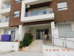 an apartment building with the front door open at Apartments Svilen Konac in Budva