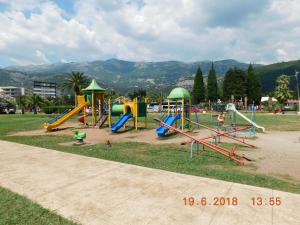 a park with a playground with a slide and slidesktop at Apartments Svilen Konac in Budva