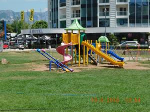 a playground with a slide in a park at Apartments Svilen Konac in Budva