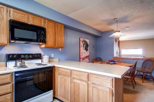 a kitchen with a stove and a counter top at Winterpoint 21 in Breckenridge
