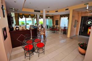 a kitchen and living room with a table and chairs at Villa Kastel in Povljana