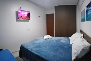 سرير أو أسرّة في غرفة في Apartamento na Cobertura do Edf- Setai- Castelo B Temporada
