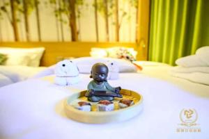 Letto o letti in una camera di Yun'an Huidu Hotel